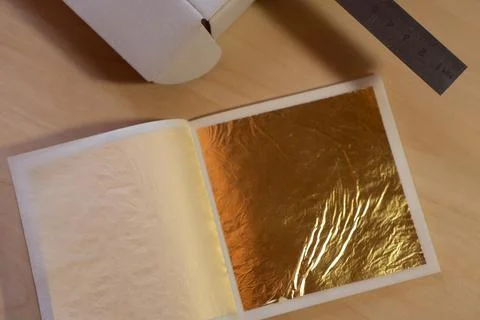 Gold leaf. Material for the work of the master. Stock Photos