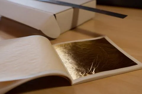Gold leaf. Material for the work of the master. Stock Photos