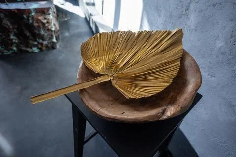 A gold leaf on a stool.interior ideas Stock Photos