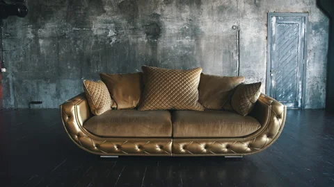 Gold leather sofa in loft on background Stock Footage 91510615