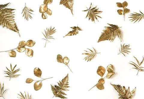 Gold leaves pattern isolated on a white background  top view.  Stock Photos