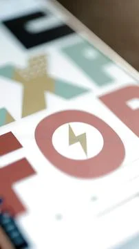 Gold lightning bolt inside red circular button Stock Photos