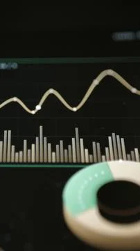 Gold line with bright plotted points crosses a dark grid Stock Photos
