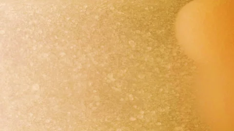 Gold liquid flow background with particles Video stock 221452559