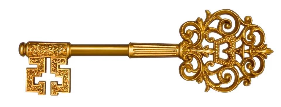 Gold master key on white Фото