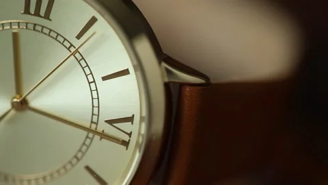 Gold metallic second arrow passing by on clock, copy space, macro Video stock 193739220