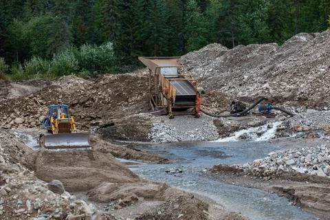 Gold mining equipment is located in the developed area Stock Photos