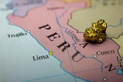Gold-nugget and a map of Peru Stock Photos