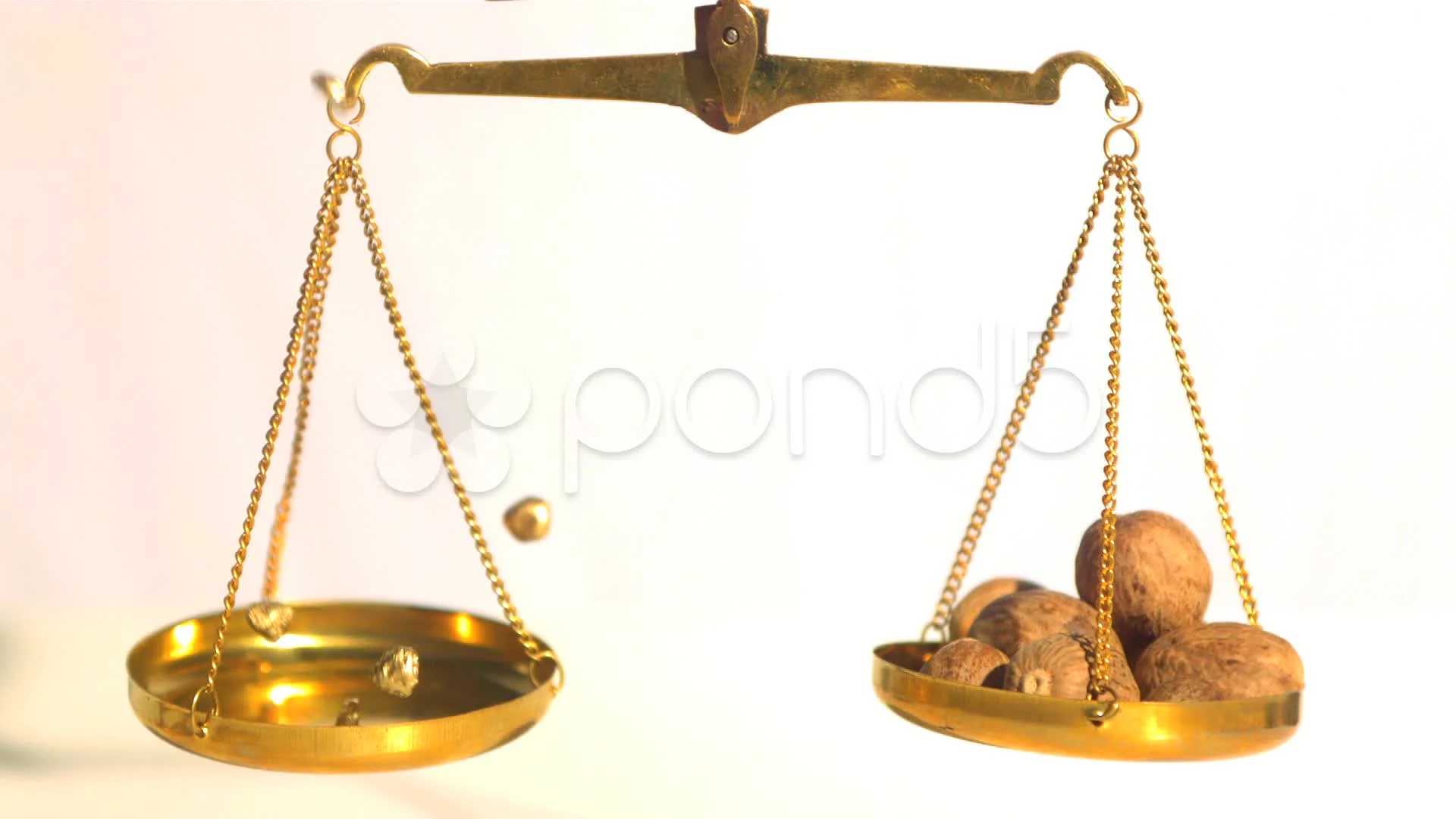 https://images.pond5.com/gold-nuggets-falling-weighing-scale-013228693_prevstill.jpeg