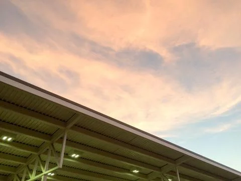 Gold orange clouds in blue sky sunset Stock Photos