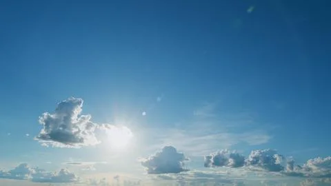 Gold orange sunset sky cloudscape. Dramatic sunset. Summer sky. Timelapse. Stock Photos