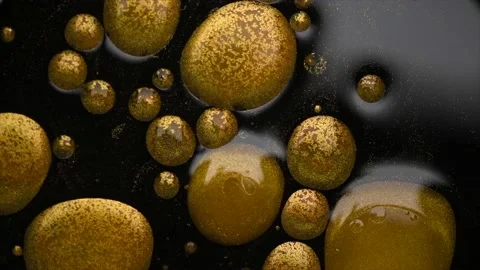 Gold paint drops sample stroke on black background. Gold metallic paint smudges Stock Footage 228831367