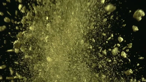 Gold Particles Exploding Stock Footage 94334999