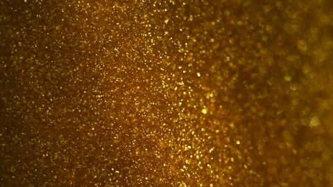 Gold particles floating background, magic dust, Liquid gold, abstract backdrop Stockbeeldmateriaal 334230906