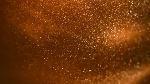 Gold particles floating background, magic dust, Liquid gold, golden backdrop Stock Footage 342666494