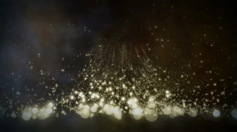 Gold particles floating upwards over a bluish gray background Stock Footage 51172810