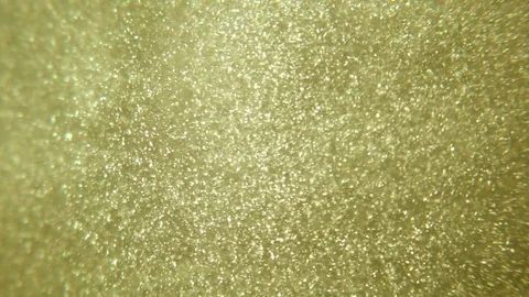 Gold particles Stock Footage 76993015