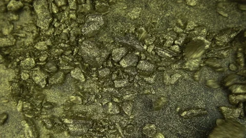 Gold Particles Getting Blown Away Stock Footage 94335406