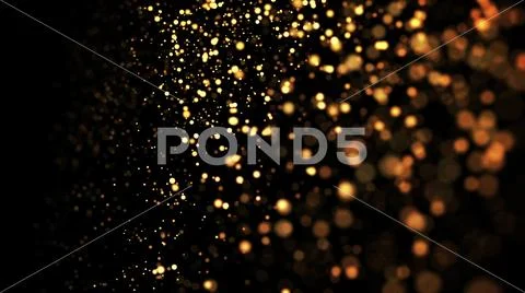 Gold particles glisten in the air, gold sparkles in a viscous fluid have the Stock Photos