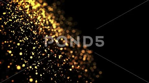 Gold particles glisten in the air, gold sparkles in a viscous fluid have the Stock Photos