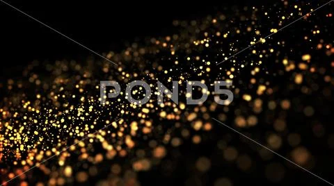 Gold particles glisten in the air, gold sparkles in a viscous fluid have the Stock Photos