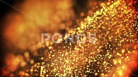 Gold particles glisten in the air, gold sparkles in a viscous fluid have the Stock Photos