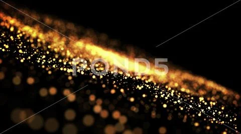 Gold particles glisten in the air, gold sparkles in a viscous fluid have the Stock Photos