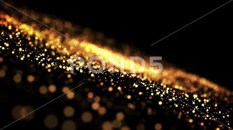 Gold particles glisten in the air, gold sparkles in a viscous fluid have the Stock Photos