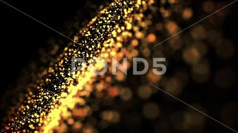 Gold particles glisten in the air, gold sparkles in a viscous fluid have the Stock Photos