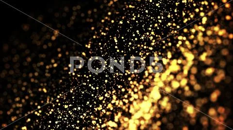 Gold particles glisten in the air, gold sparkles in a viscous fluid have the Stock Photos