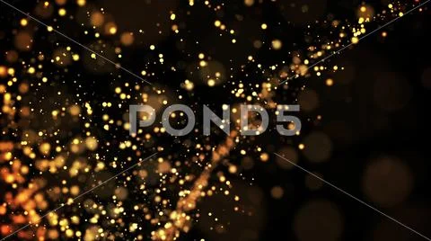 Gold particles glisten in the air, gold sparkles in a viscous fluid have the Stock Photos