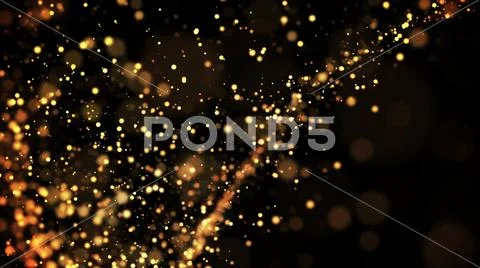 Gold particles glisten in the air, gold sparkles in a viscous fluid have the Stock Photos
