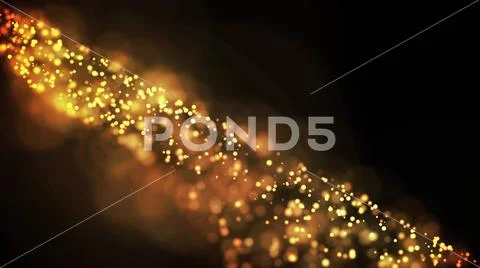 Gold particles glisten in the air, gold sparkles in a viscous fluid have the Stock Photos