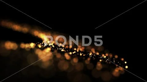 Gold particles glisten in the air, gold sparkles in a viscous fluid have the Stock Photos