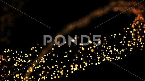 Gold particles glisten in the air, gold sparkles in a viscous fluid have the Stock Photos