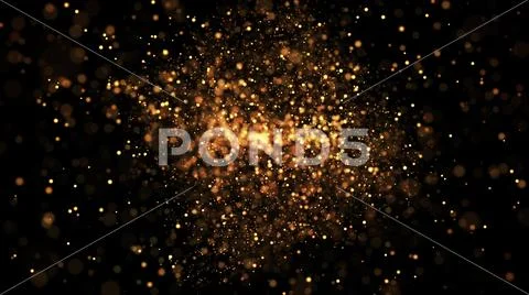Gold particles glisten in the air, gold sparkles in a viscous fluid have the Stock Photos