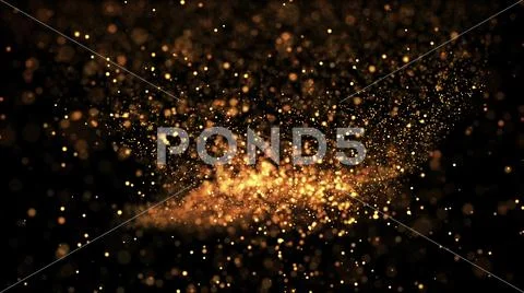 Gold particles glisten in the air, gold sparkles in a viscous fluid have the Stock Photos