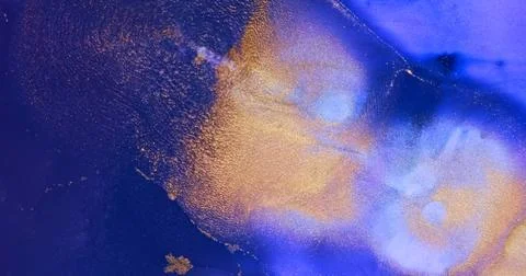 Gold particles sparkle, flow in purple paint abstract background. Shiny ink Stock Illustration