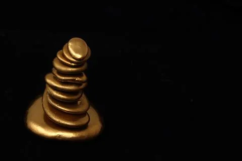 Gold pebble tower Stock Photos