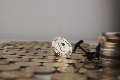 Gold peercoin mining Stock Photos