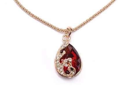 Gold pendant with ruby isolated on white Stock Photos