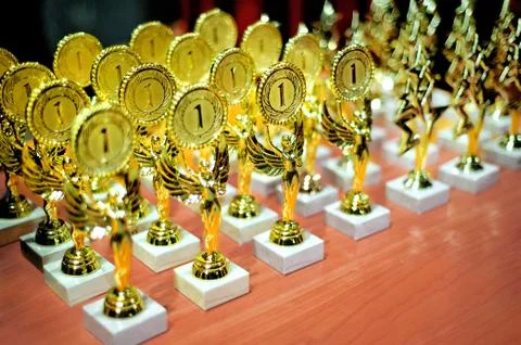 Gold premium cups on the table Stock Photos