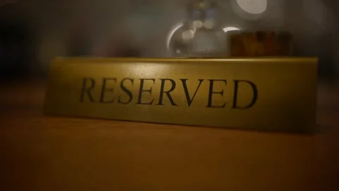 A gold reserved sign sits Stock Footage 346298697