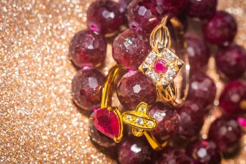 Gold ring and ruby beaded bracelet 스톡 사진