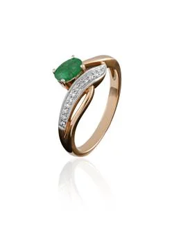 Gold ring with an emerald Stock Photos