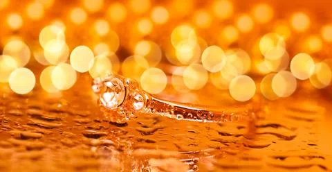 Gold ring featuring three clear faceted stones Stock Photos