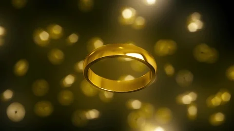 Gold Ring Floating Against a Bokeh Background 库存影片 72299698