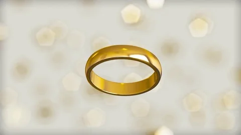 Gold Ring Floating Against a White Background Stock Footage 72299699