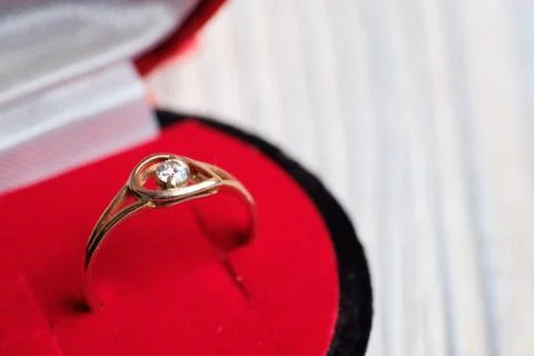 Gold ring in a gift box. The concept of getting married. Stock Photos