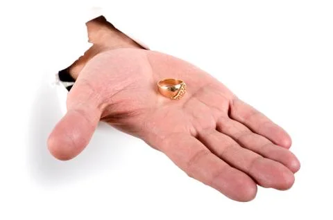 Gold ring on the hand Stock Photos